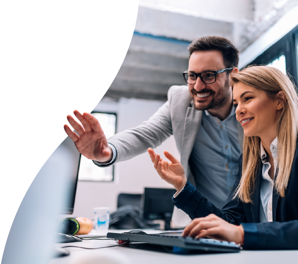 An IT employee operates a laptop in a server room